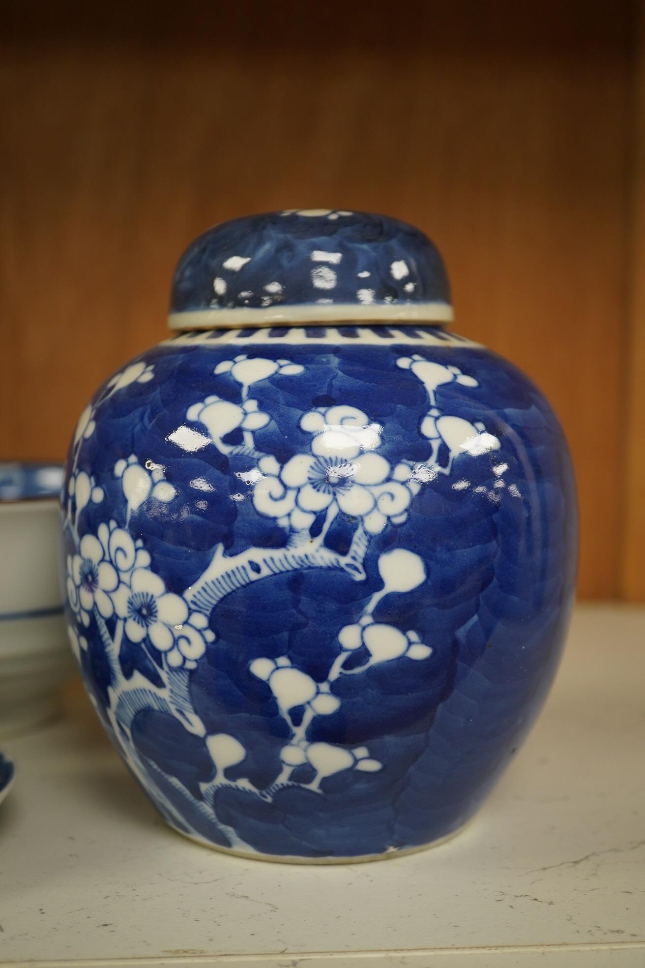 A group of Chinese blue and white porcelain, including a mid 19th century Canton enamel teabowl and a Japanese small dish, tallest 22cm. Condition - fair